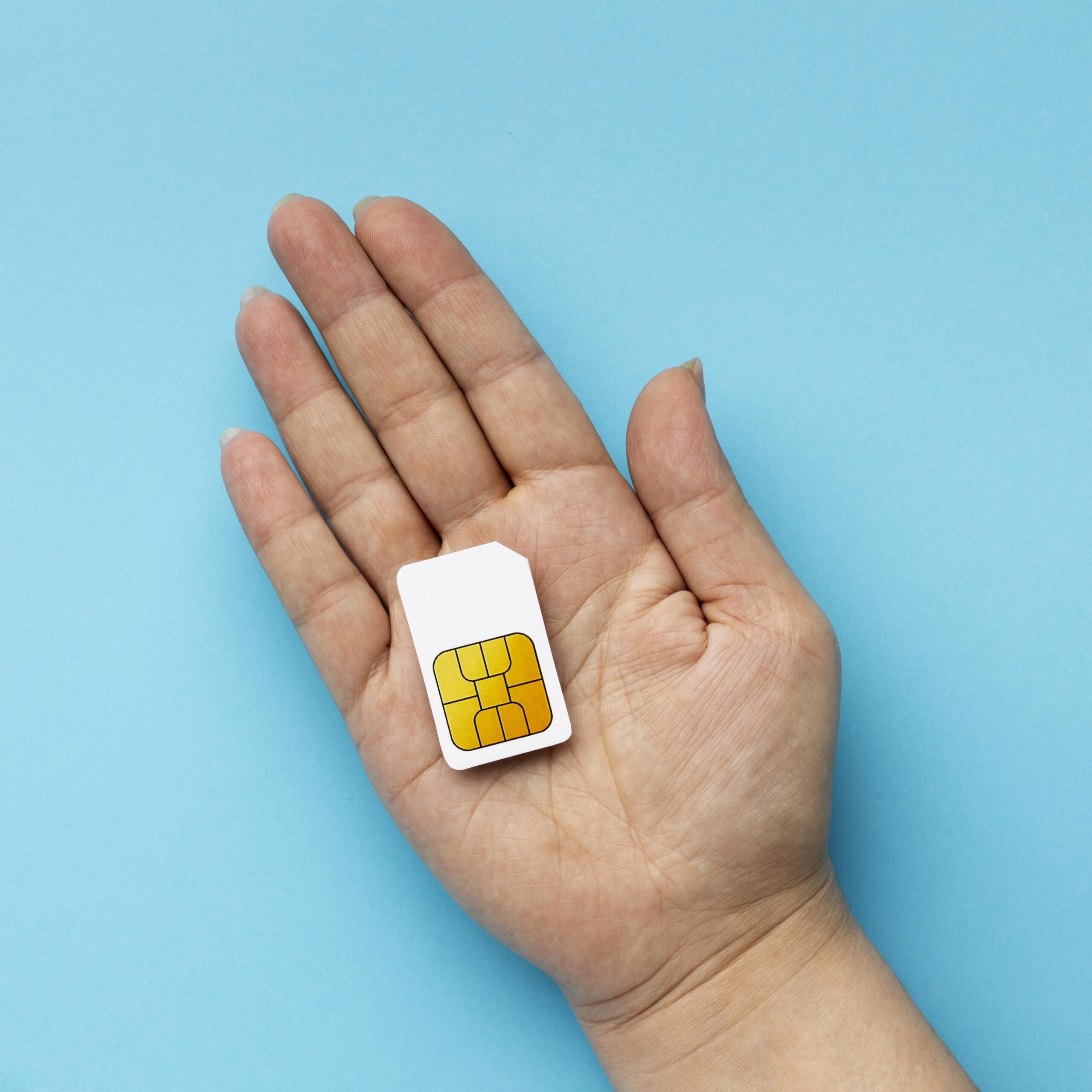 top-view-hand-holding-sim-card